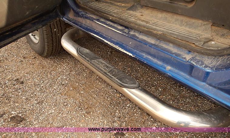 image for item E7779 2003 Chevrolet Silverado 3500 stake body flatbed truck with crane