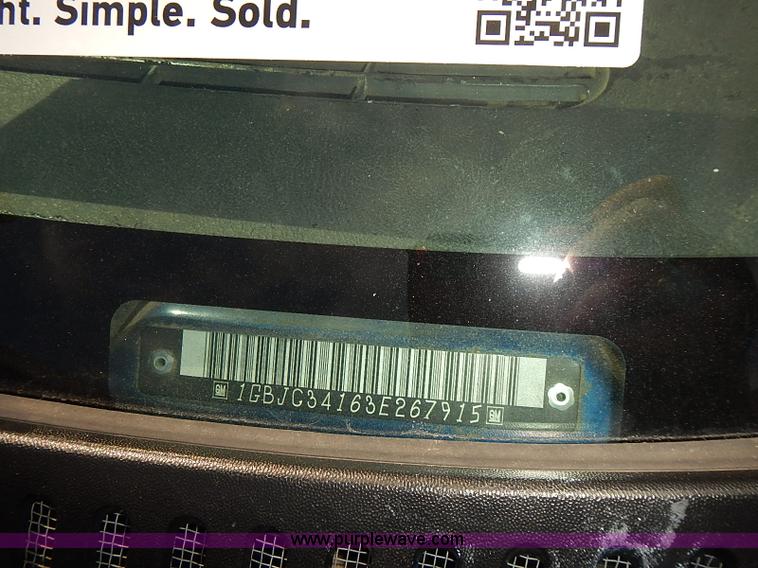 image for item E7779 2003 Chevrolet Silverado 3500 stake body flatbed truck with crane