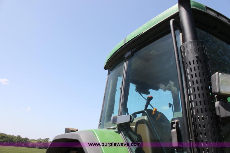 image for item F3327 1999 John Deere 7710 MFWD tractor