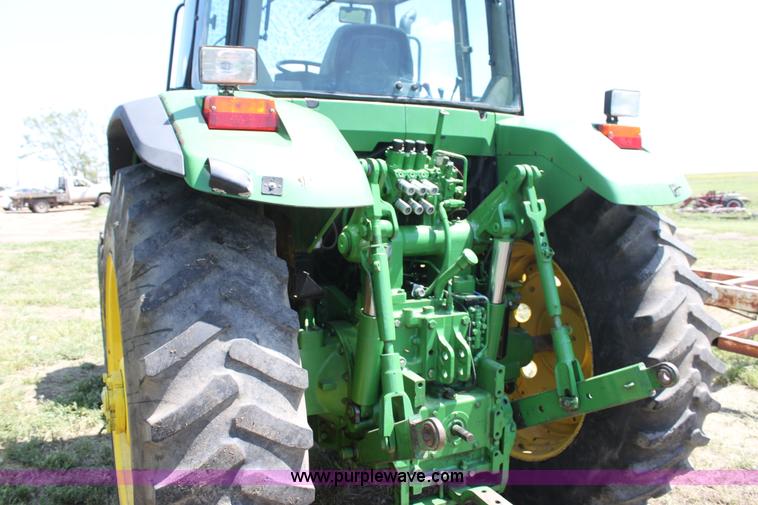 image for item F3327 1999 John Deere 7710 MFWD tractor