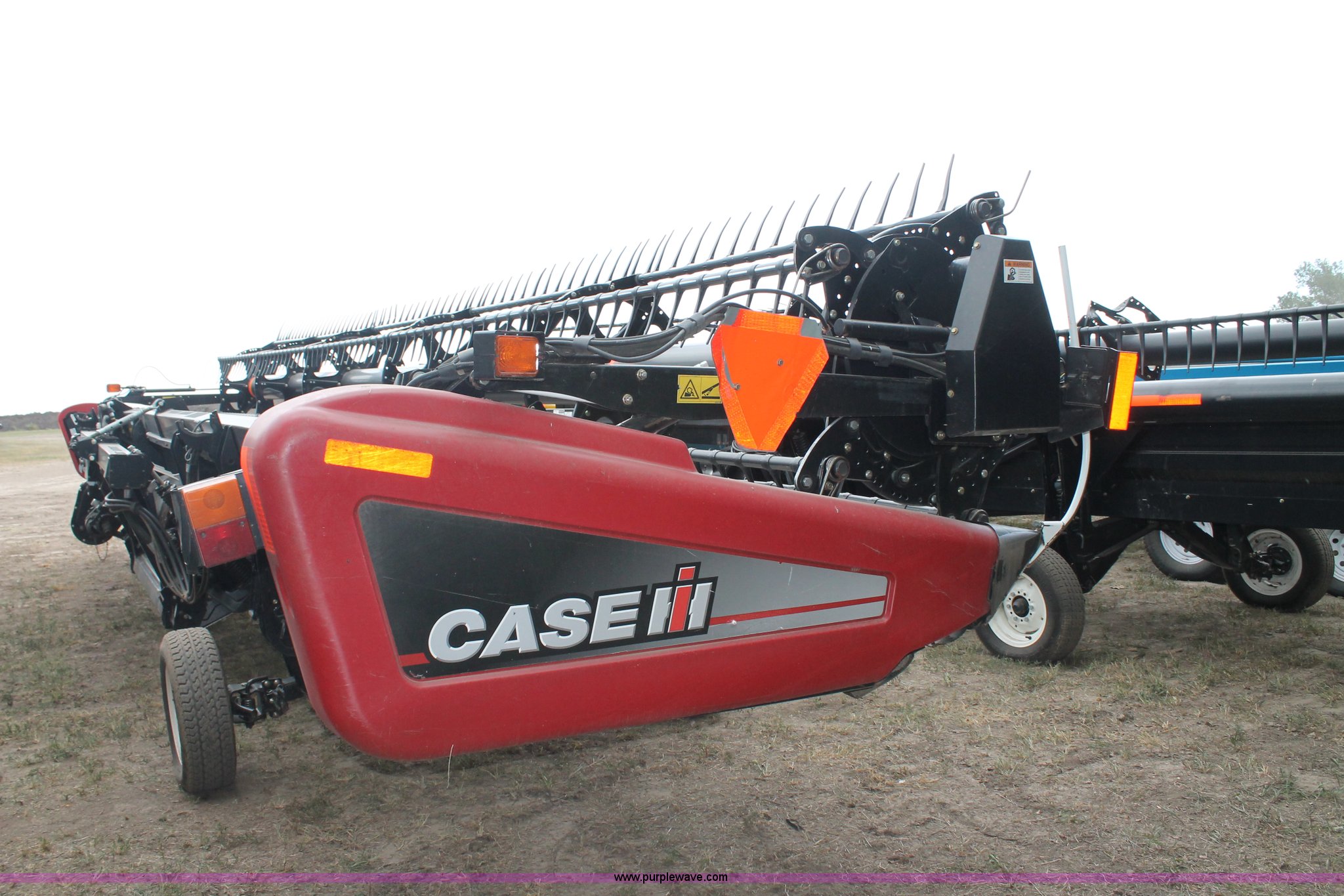 2010 Case IH 2142 draper header in Hoxie, KS Item G8167 sold Purple Wave