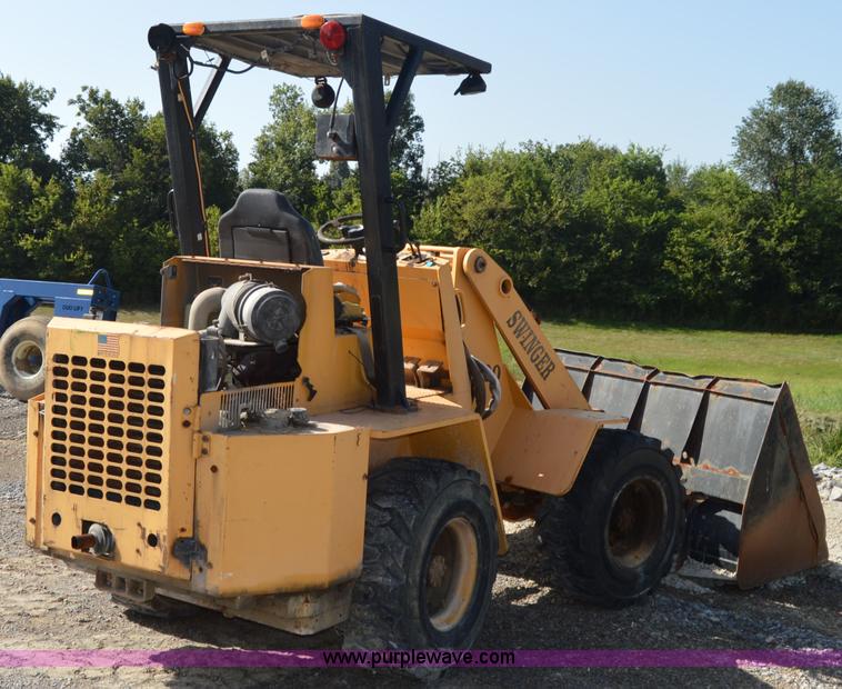 image for item H2754 2002 NMC-Wollard Swinger 3000 wheel loader