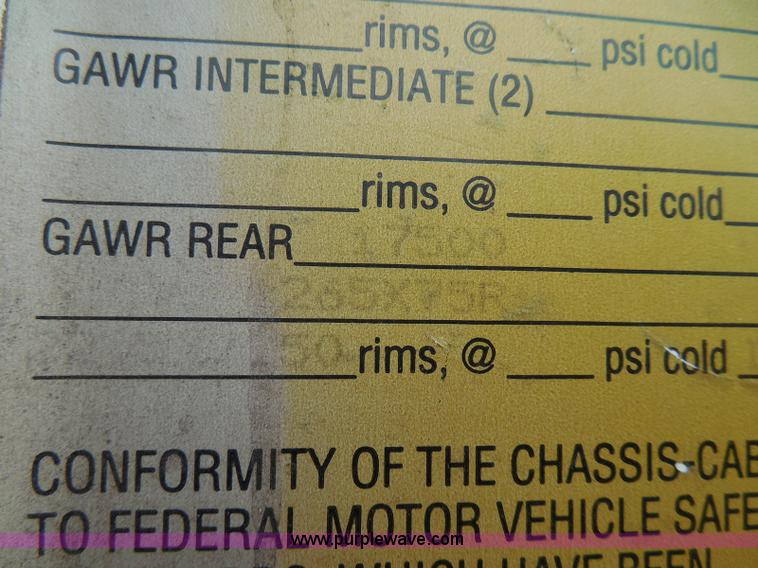 image for item I3383 2000 International 4700 Lo-Profile flatbed truck