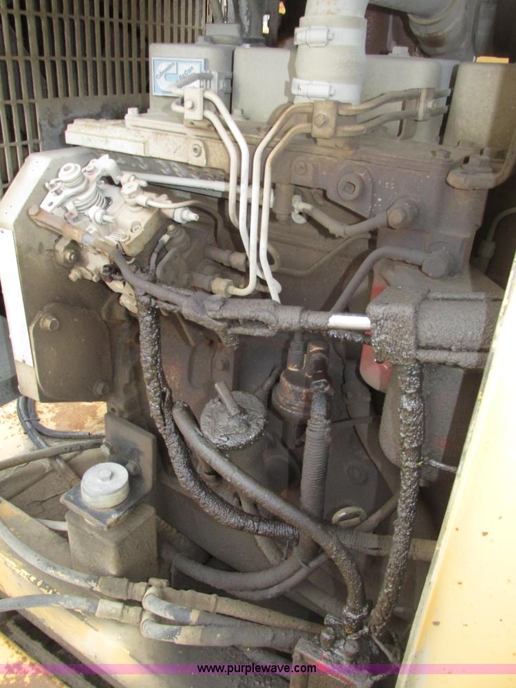 image for item G9993 1988 Lincoln 660H windrow elevator