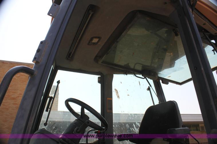 image for item I7262 New Holland 555E backhoe