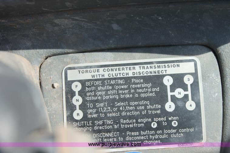 image for item I7262 New Holland 555E backhoe