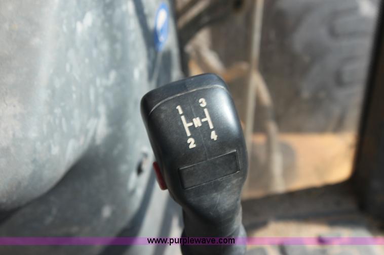 image for item I7262 New Holland 555E backhoe