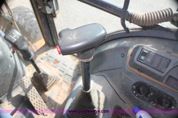 image for item I7262 New Holland 555E backhoe