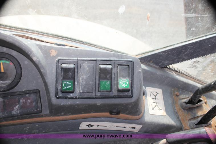 image for item I7262 New Holland 555E backhoe