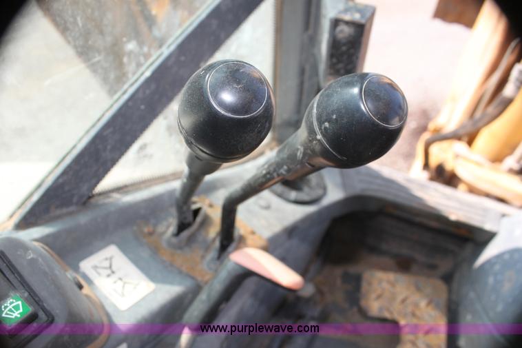 image for item I7262 New Holland 555E backhoe