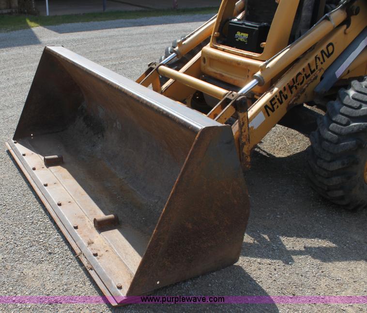 image for item I7262 New Holland 555E backhoe