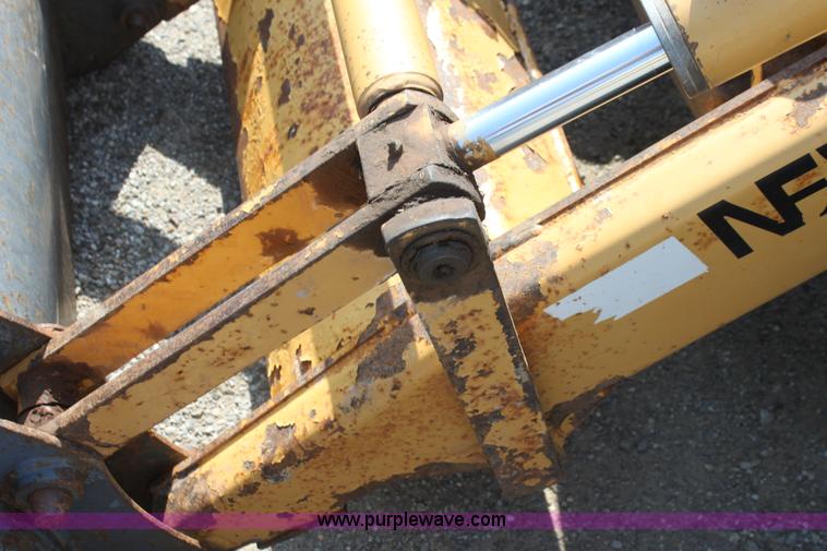 image for item I7262 New Holland 555E backhoe