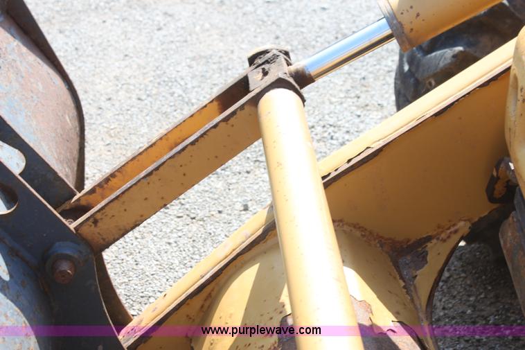 image for item I7262 New Holland 555E backhoe