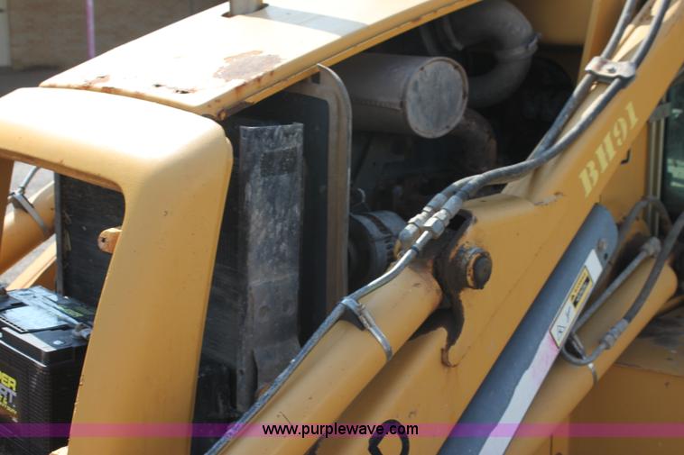 image for item I7262 New Holland 555E backhoe