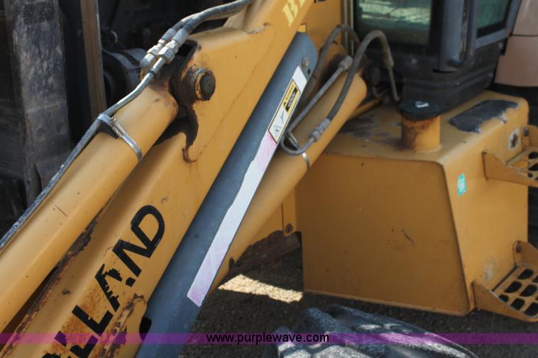 image for item I7262 New Holland 555E backhoe