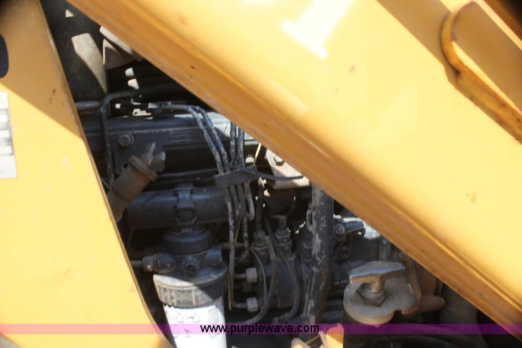 image for item I7262 New Holland 555E backhoe