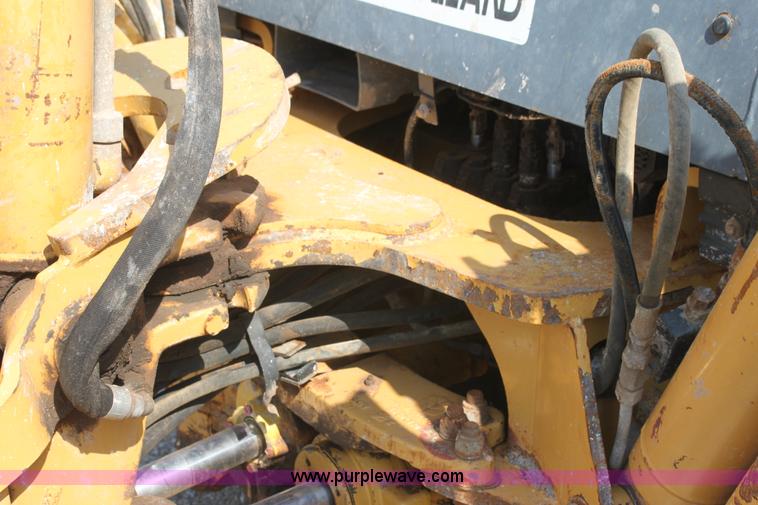 image for item I7262 New Holland 555E backhoe