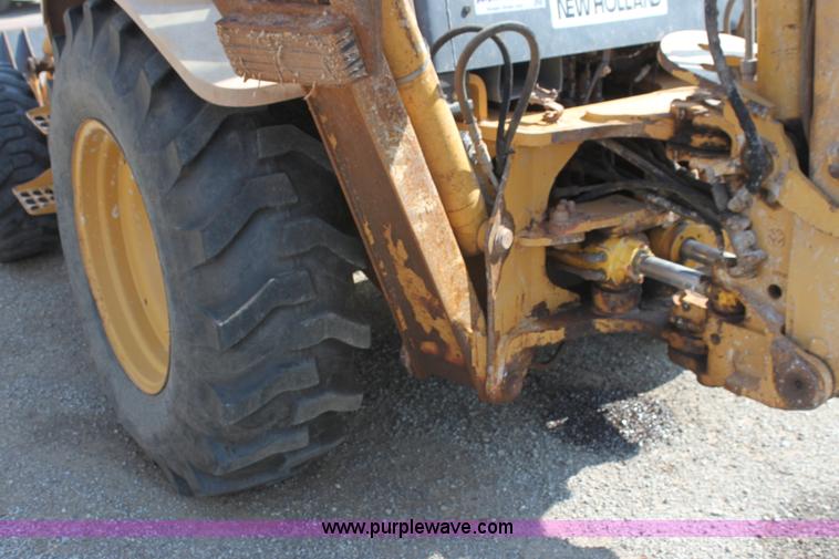 image for item I7262 New Holland 555E backhoe