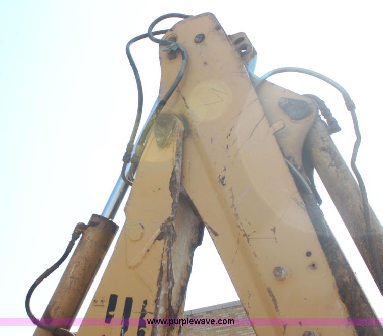 image for item I7262 New Holland 555E backhoe