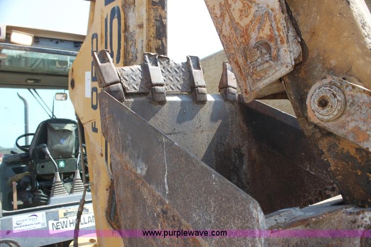 image for item I7262 New Holland 555E backhoe
