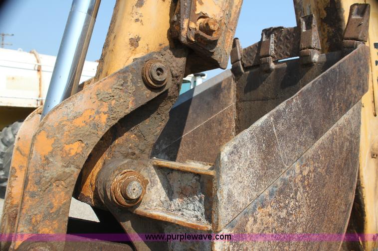 image for item I7262 New Holland 555E backhoe