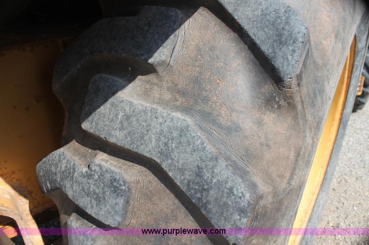 image for item I7262 New Holland 555E backhoe