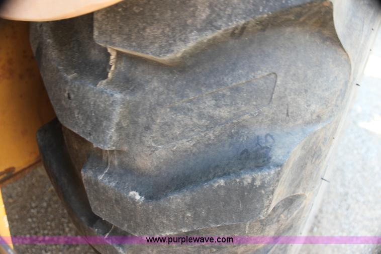 image for item I7262 New Holland 555E backhoe