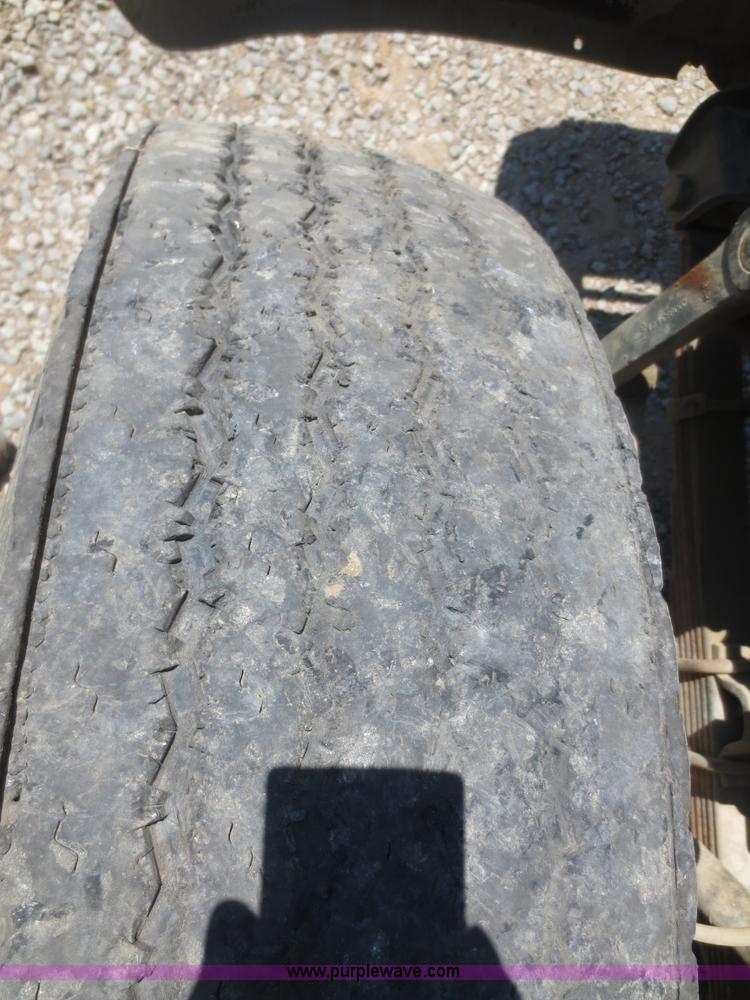 image for item F8291 1998 International 4700 chip bed truck