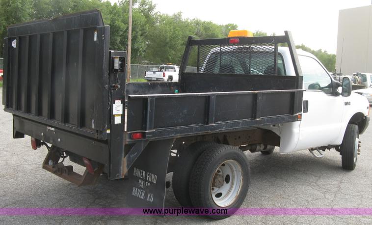 image for item E7877 2000 Ford F450 Super Duty XL flatbed truck