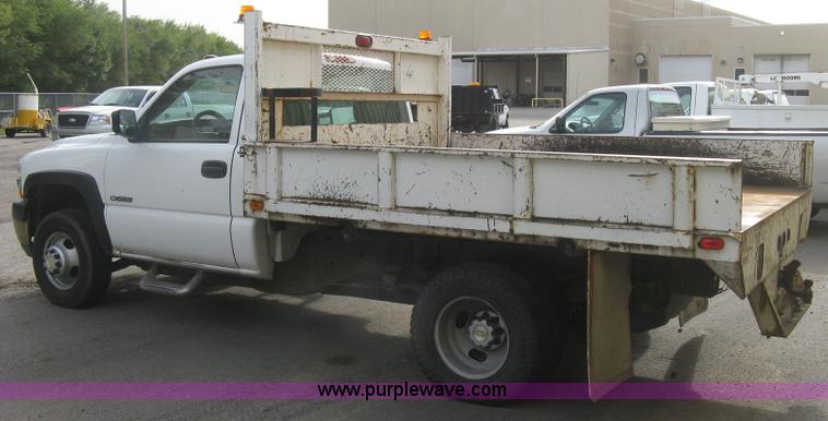 image for item E7878 2002 Chevrolet Silverado 3500 flatbed dump truck