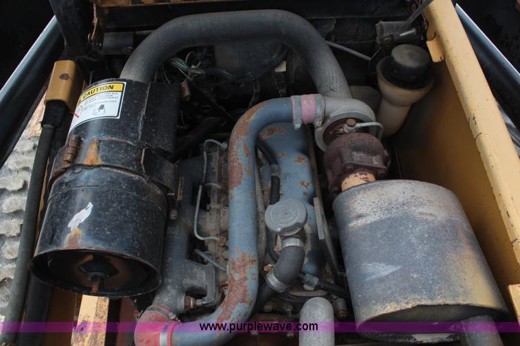 image for item J2042 1995 New Holland LX885 skid steer