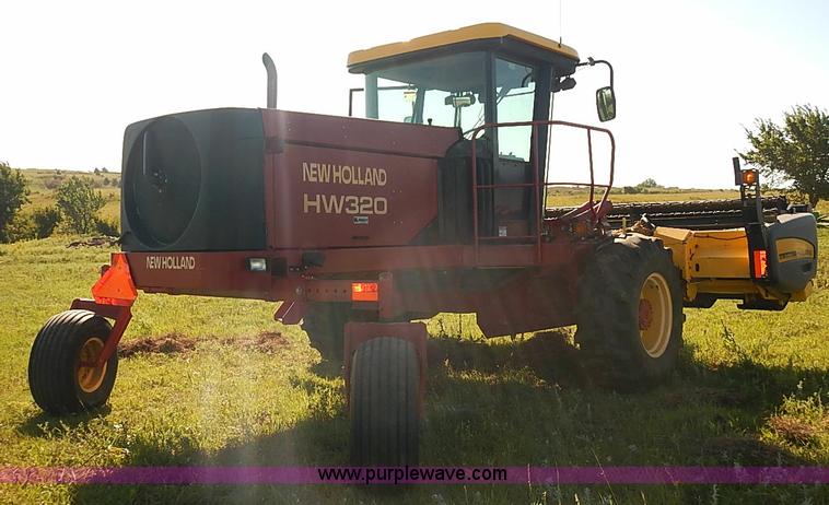 image for item J2239 2003 New Holland HW320 self-propelled swather