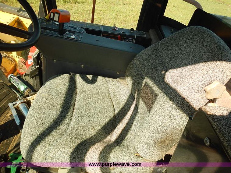image for item J2239 2003 New Holland HW320 self-propelled swather