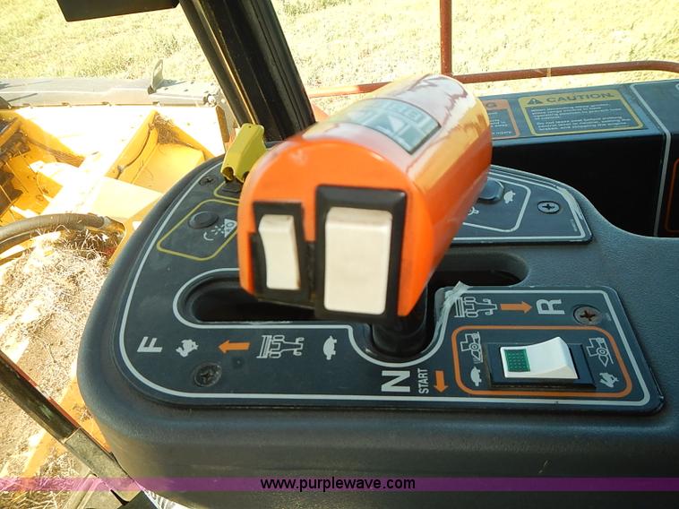 image for item J2239 2003 New Holland HW320 self-propelled swather