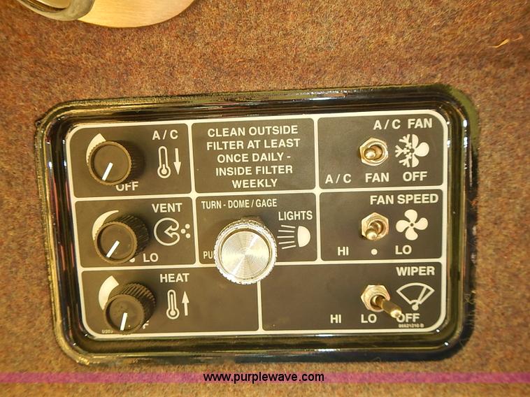 image for item J2239 2003 New Holland HW320 self-propelled swather