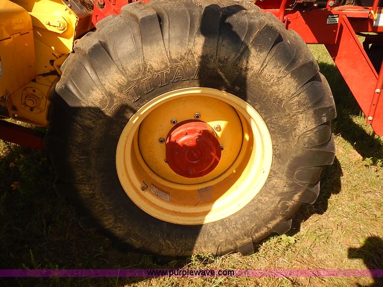 image for item J2239 2003 New Holland HW320 self-propelled swather