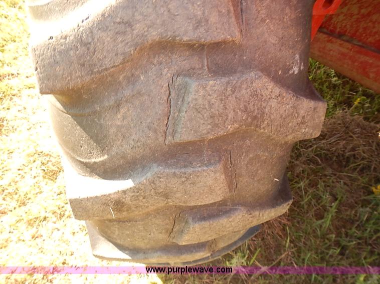 image for item J2239 2003 New Holland HW320 self-propelled swather