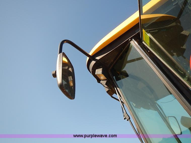 image for item J2239 2003 New Holland HW320 self-propelled swather