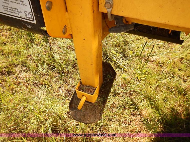 image for item J2239 2003 New Holland HW320 self-propelled swather