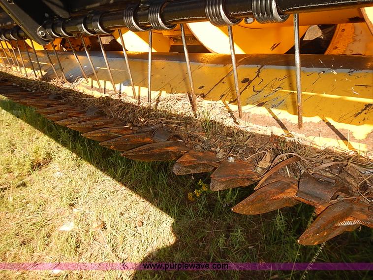 image for item J2239 2003 New Holland HW320 self-propelled swather
