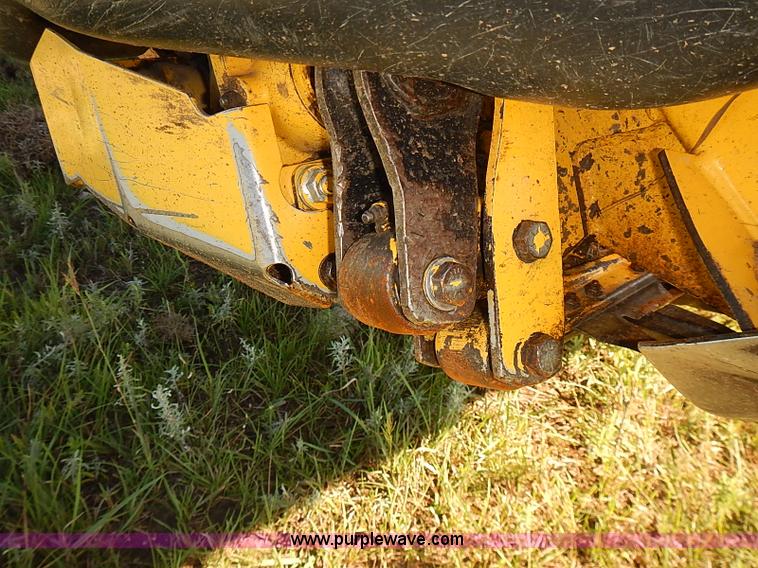 image for item J2239 2003 New Holland HW320 self-propelled swather