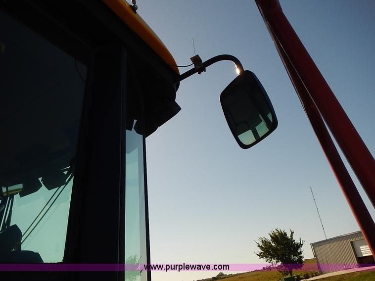 image for item J2239 2003 New Holland HW320 self-propelled swather