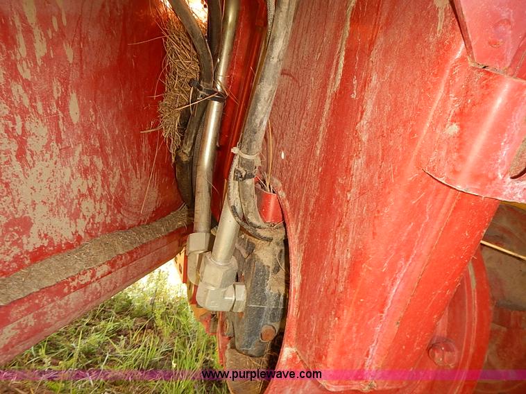 image for item J2239 2003 New Holland HW320 self-propelled swather