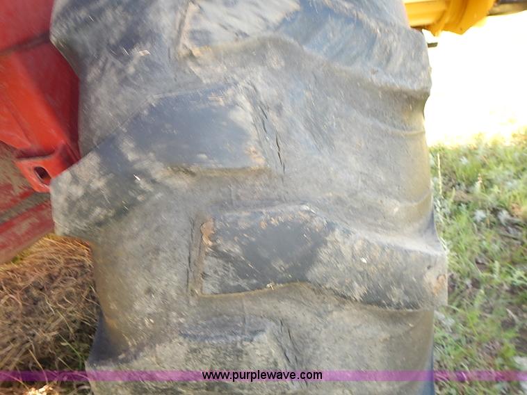 image for item J2239 2003 New Holland HW320 self-propelled swather