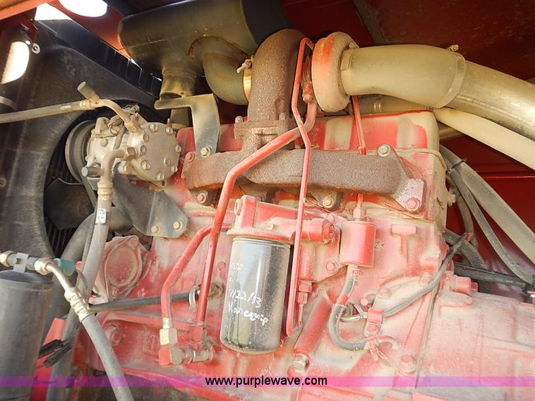 image for item J2239 2003 New Holland HW320 self-propelled swather