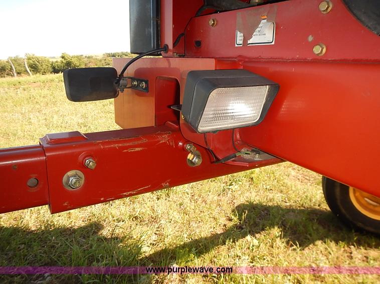 image for item J2239 2003 New Holland HW320 self-propelled swather