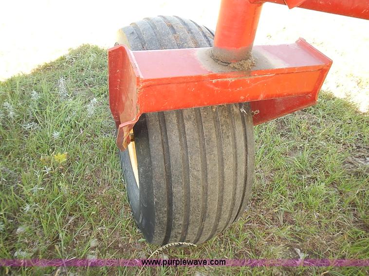 image for item J2239 2003 New Holland HW320 self-propelled swather