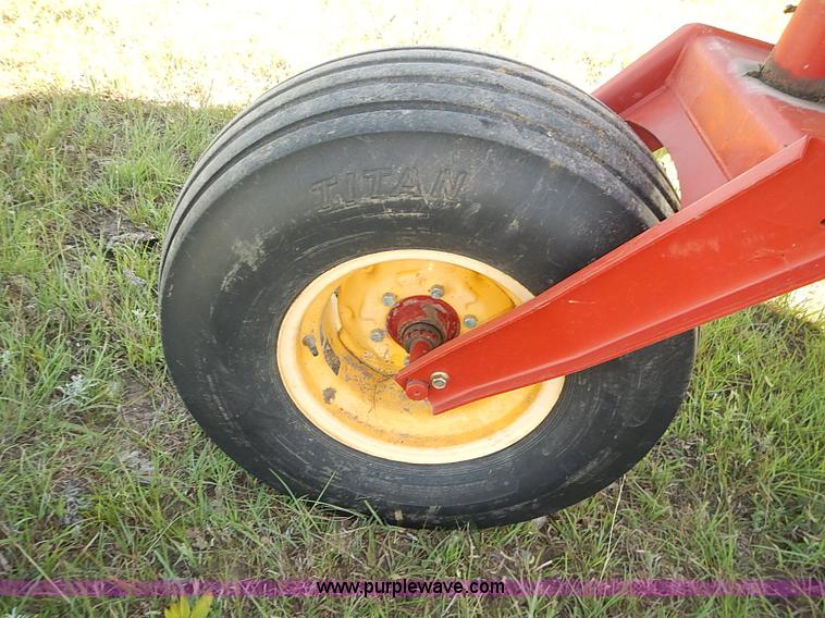 image for item J2239 2003 New Holland HW320 self-propelled swather