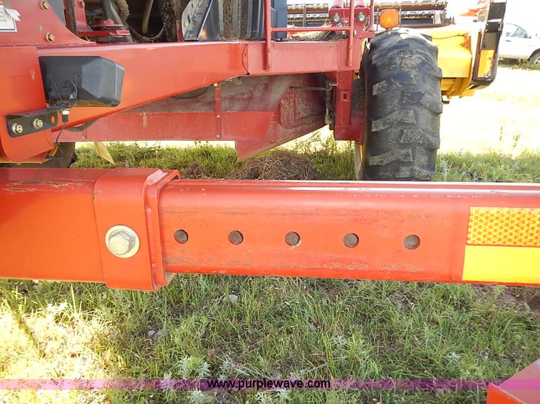 image for item J2239 2003 New Holland HW320 self-propelled swather