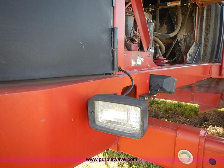 image for item J2239 2003 New Holland HW320 self-propelled swather